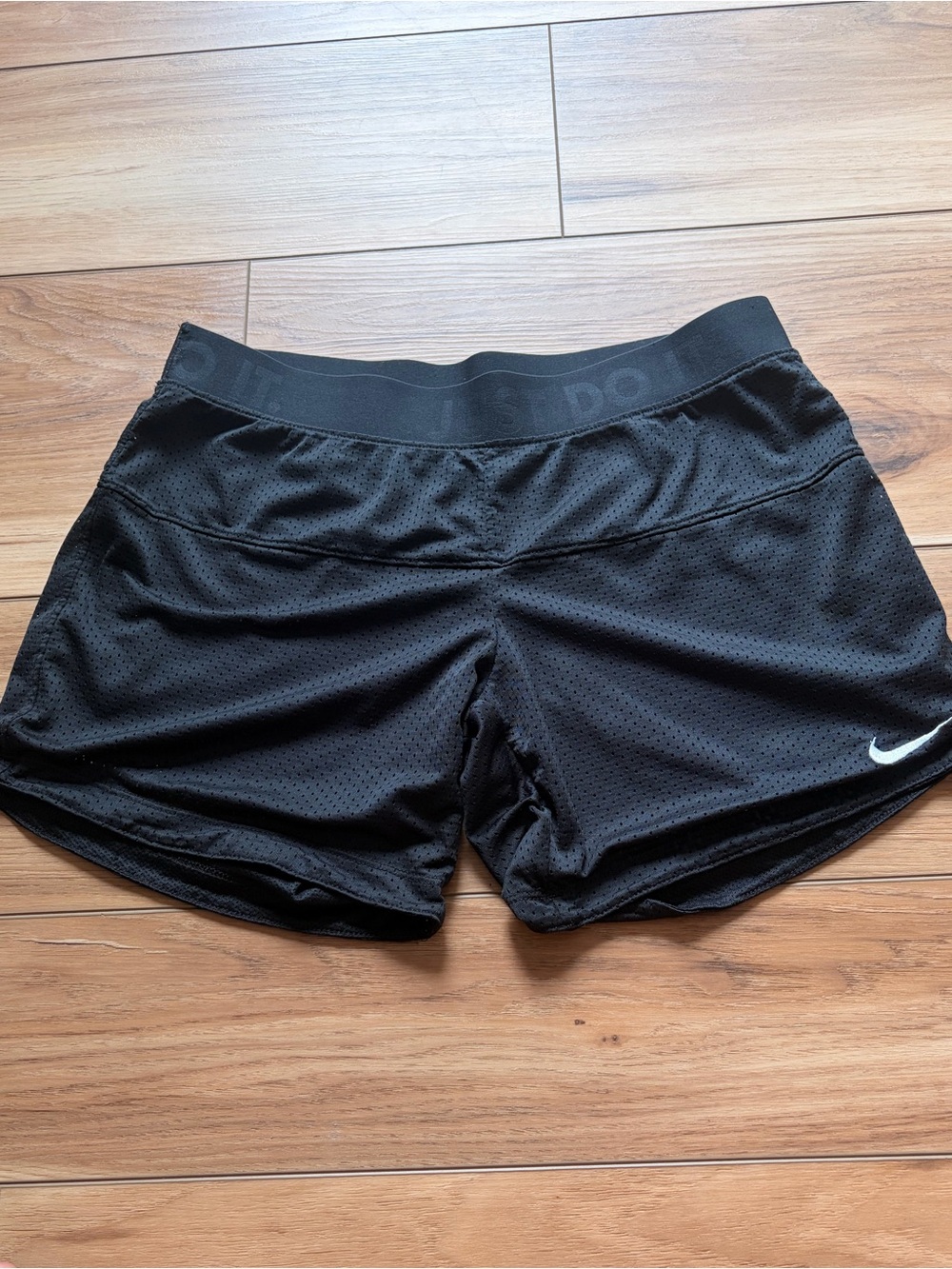 Nike Women's Black Perforated Reversible Athletic Shorts with Swoosh